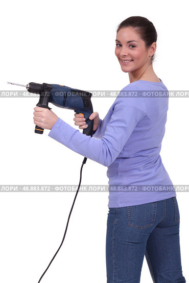 Woman with drill. Стоковое фото, агентство Ingram Publishing / Фотобанк Лори