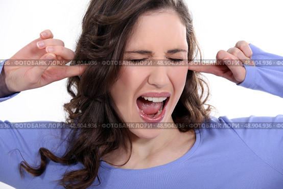 Woman with her fingers in her ears. Стоковое фото, агентство Ingram Publishing / Фотобанк Лори