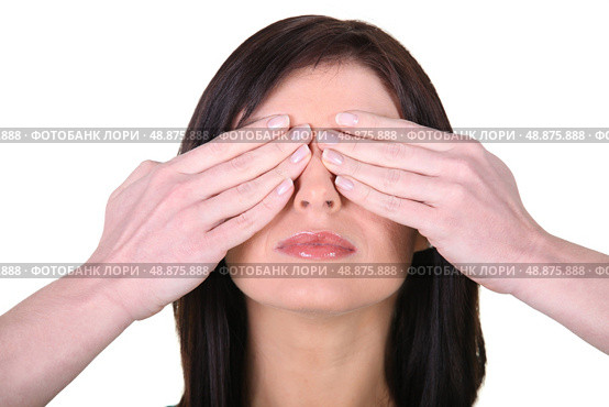 Woman with her hands over her eyes. Стоковое фото, агентство Ingram Publishing / Фотобанк Лори