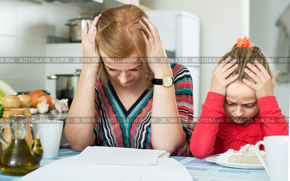 woman working from home, little daughter asking for attention. Стоковое фото, фотограф Яков Филимонов / Фотобанк Лори
