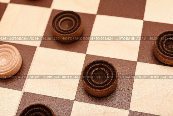 Wooden checkers on the board. The board game checkers. Стоковое фото, фотограф Valeriy Lushchikov / Фотобанк Лори