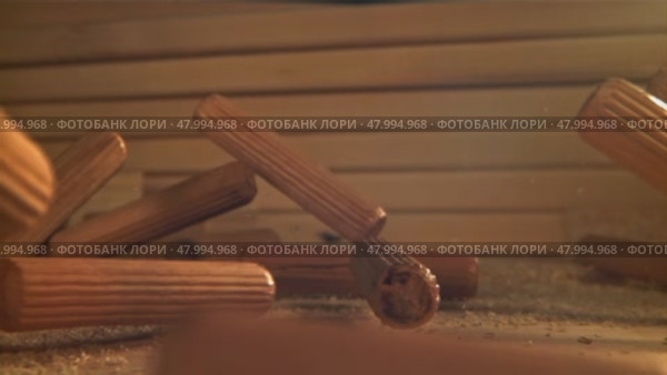 Wooden fasteners fall on the table. Filmed on a high-speed camera at 1000 fps. Стоковое видео, видеограф Артем Шадрин / Фотобанк Лори