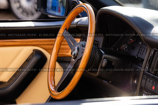 Wooden steering wheel in car. Car interior with dashboard, speedometer and tachometer. Стоковое фото, фотограф Константин Григорьев / Фотобанк Лори
