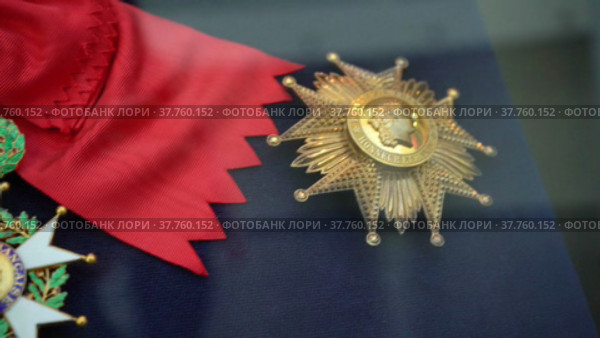 Yekaterinburg, Russia - April 2022: the insignia of the Chevalier of the Grand Cross of the Order of the Legion of Honor. 1st degree of the highest state award of France. Редакционное видео, видеограф Владимир Федоров / Фотобанк Лори