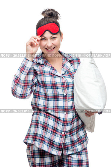 Young beautiful woman in plaid pajamas posing in studio before bedtime. Стоковое фото, фотограф Константин Лабунский / Фотобанк Лори