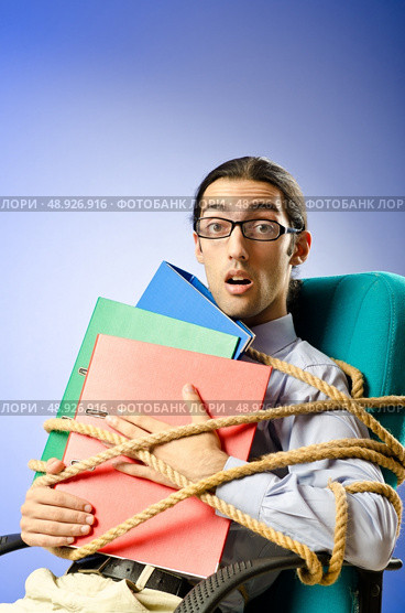 Young businessman tied with rope. Стоковое фото, агентство Ingram Publishing / Фотобанк Лори