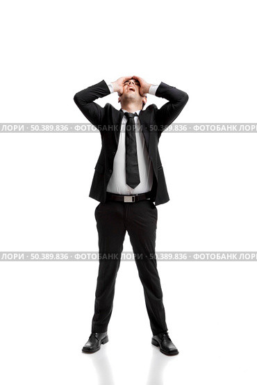 Young businessman worried with a bad business, isolated over a white background . Стоковое фото, агентство Ingram Publishing / Фотобанк Лори