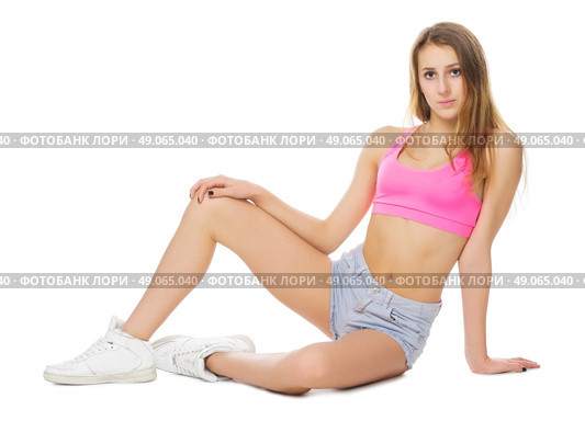 Young girl in jeans shorts isolated. Стоковое фото, агентство Ingram Publishing / Фотобанк Лори
