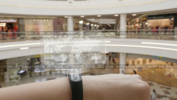 Young girl press on futuristic user interface concept bracelet. Graphical User Interface - GUI. Head up Display - HUD. Internet of things. Стоковое видео, видеограф Dzmitry Astapkovich / Фотобанк Лори