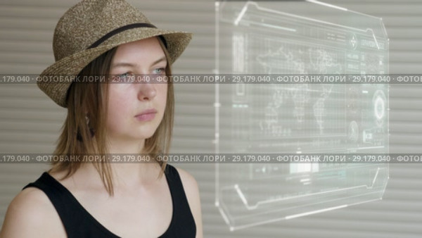 Young girl press on futuristic user interface concept screen. Graphical User Interface - GUI. Head up Display - HUD. Internet of things. Стоковое видео, видеограф Dzmitry Astapkovich / Фотобанк Лори