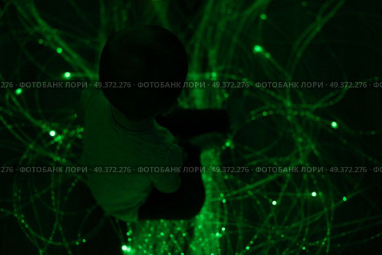 Young kid exploring snoezelen space. Young kid exploring a multi sensory space - snoezelen concept. Стоковое фото, агентство Ingram Publishing / Фотобанк Лори