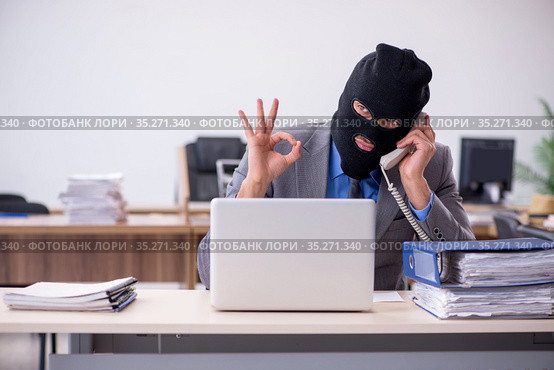 Young male employee in industrial espionage concept. Стоковое фото, фотограф Elnur / Фотобанк Лори