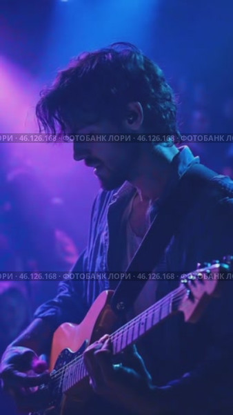 Young male musician playing electric guitar during a concert. Стоковое AI-видео, аниматор Юрий Поздников / Фотобанк Лори