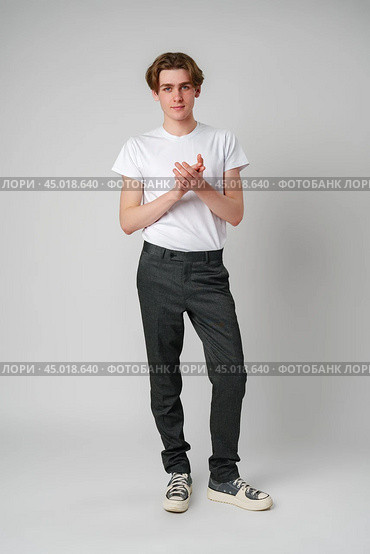 Young Man in White T-Shirt and Black Pants. Стоковое фото, фотограф Сергей Толмачёв / Фотобанк Лори