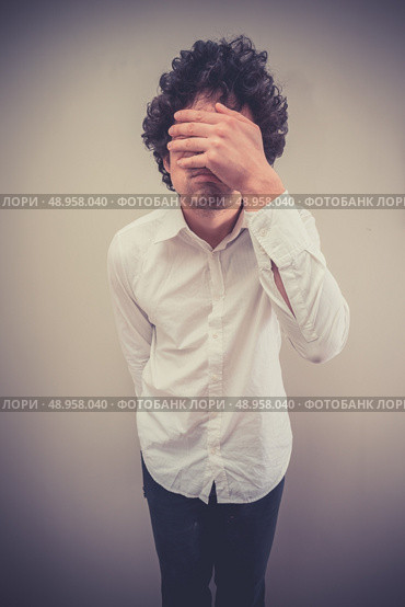 Young man is face palming. Стоковое фото, агентство Ingram Publishing / Фотобанк Лори