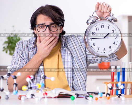 Young student physicist preparing for exam at home. Стоковое фото, фотограф Elnur / Фотобанк Лори