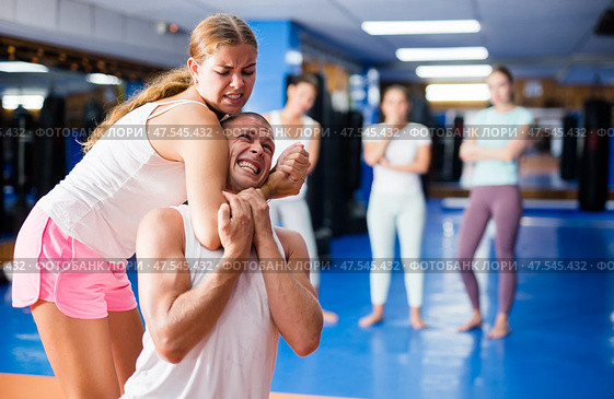 Young woman practicing self defence techniques with coach. Стоковое фото, фотограф Яков Филимонов / Фотобанк Лори