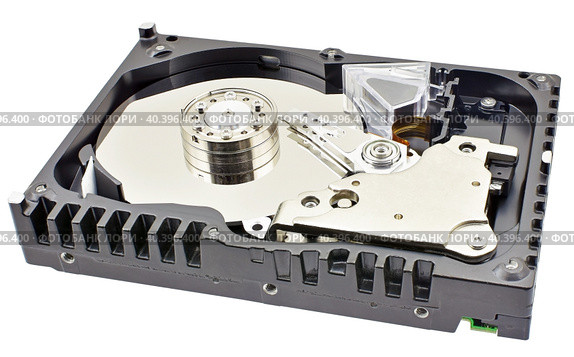 Жесткий диск персонального компьютера без верхней крышки. Opened computer hard drive isolated on white background. Стоковое фото, фотограф Татьяна Д / Фотобанк Лори